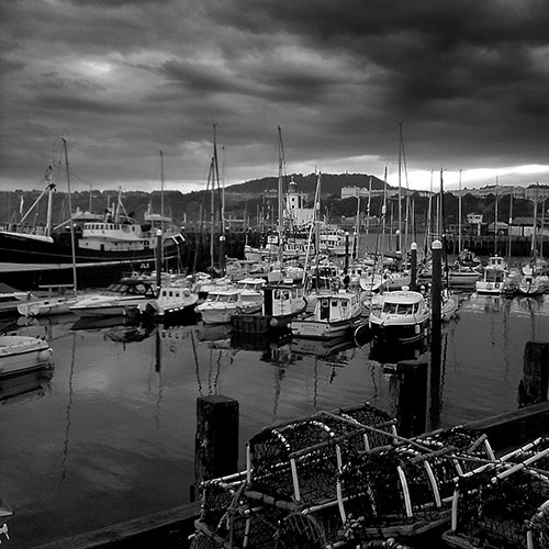 Lobster cages and fishing boats docked at Scarborough